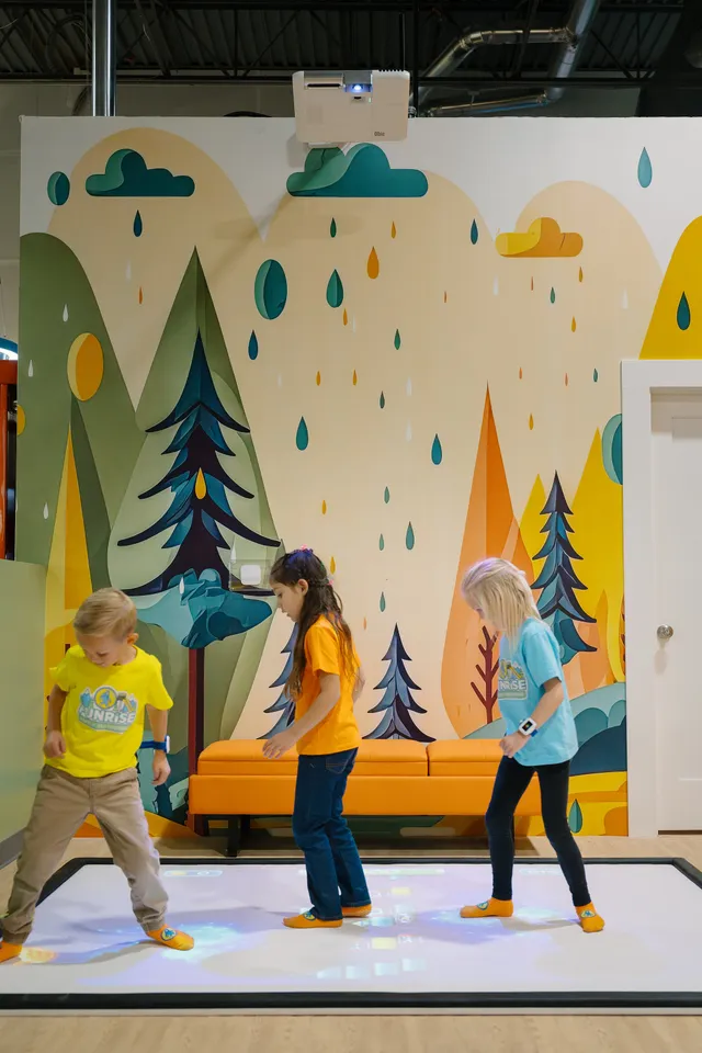 Kids playing on the interactive projection floor